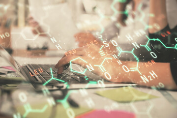 Double exposure of woman hands typing on computer and formula hologram drawing. Education concept.