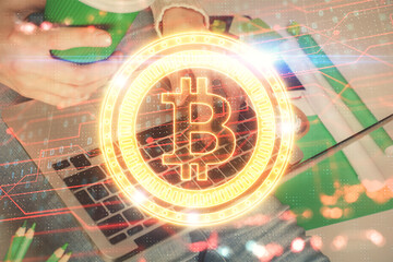 Double exposure of woman hands typing on computer and crypto market theme hologram drawing. Blockchain concept.