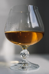 elegant brandy snifter glass in daylight