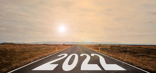 The word 2022 written on highway road in the middle of empty asphalt road
