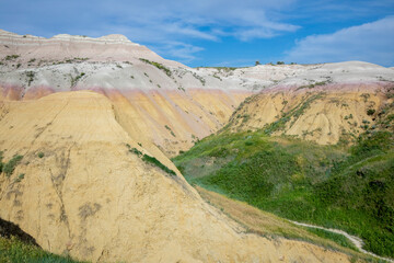 Yellow Mounds Overlook in Badland national park during summer. From grassland to valley. Badland landscape South Dakota.