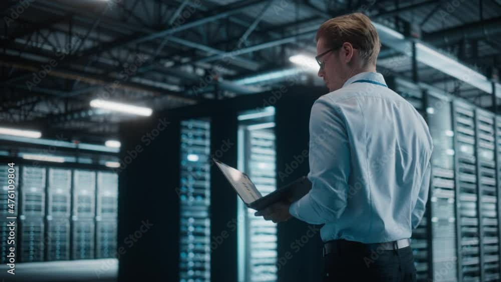 Poster Male IT Specialist Using Tablet Computer in Data Center, Walking Through Big Data Center. Cloud Services Server, Computing Facility. Successful e-Business Digital Entrepreneur or System Administrator