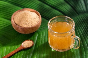 Lepidium meyenii - Maca root health drink in a glass with powdered