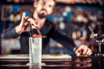 Bartender mixes a cocktail in the brasserie