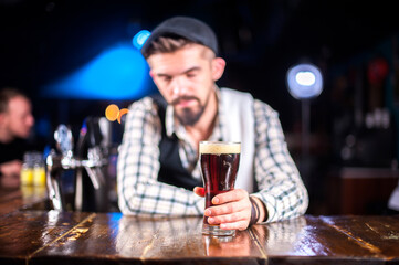 Bartender concocts a cocktail on the taproom
