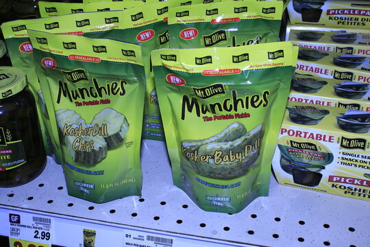 A closeup shot of MT Olive Munchies Kosher Baby Dills in bags that you can take any were for as snack at a Dillons store in Hutchinson Kansas USA.