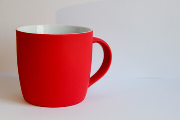 Blank red mug isolated on white background,mat tea or coffee cup,mock up with ceramic mug for hot drinks,empty gift print branding template,tankard for design,placement for logo,christmas decoration.