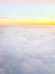 Fototapeta na wymiar Clouds and sky background, bird's eye view at sunset, dawn, beautiful atmospheric pastel background