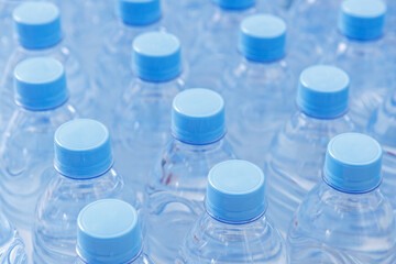 There are many bottles with clean cool mineral water.