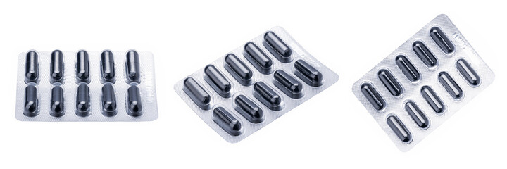 pill blister pack isolated on a white background. drug package cut out. black tablets stack