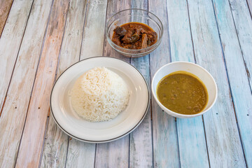 Arroz con gandules is a combination of rice, pigeon peas and pork cooked in the same pot with a Puerto Rican style sofrito. It is the star dish of Puerto Rican gastronomy
