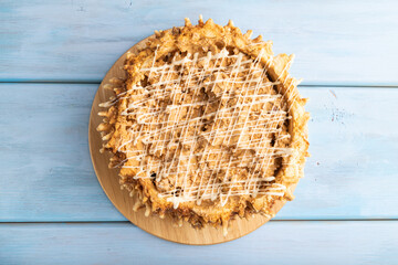 Traditional lithuanian cake shakotis on blue, top view, close up.
