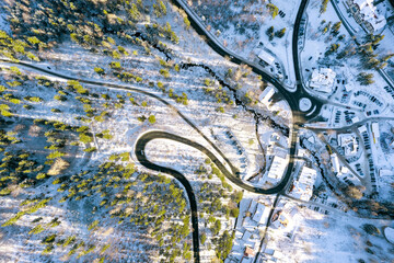 Winter landscape from the air, many winding mountain roads. Winter forest from above and Karpacz...