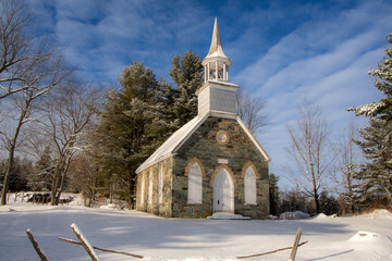 Winter landscape with the nice Frost Church. Magnificent little stone church