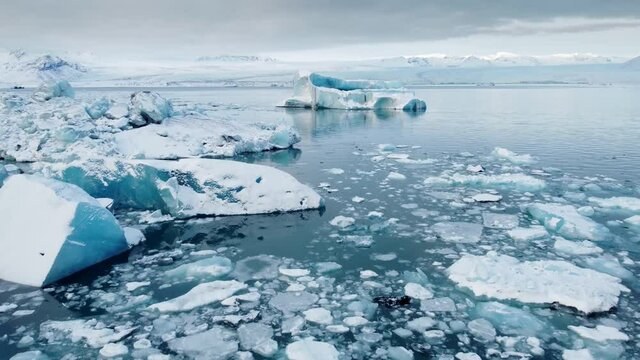 Icebergs from melting glacier in ice lagoon. Majestic Arctic Deep Clear Water. Climate Change Global Warming problem. Iceland.