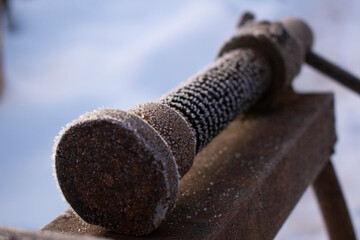 rusty vise in the snow
