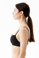 Fototapeta premium Model tests. Snap Models back view, Beautiful brunette woman in underwear, isolated on white.
