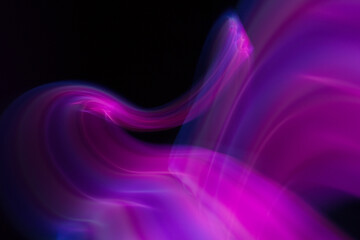Abstraction of lines of colored blurred light.