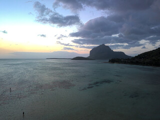 Aerial view of Le Morne Brabant mountain during sunset at La Prairie beach located on the south west coast of Mauritius island
