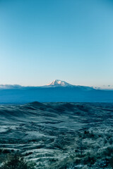 Vertical shot of Mount Ararat under a blue sky and sunlight in autumn