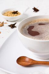 Cup of Hot chocolate drink with homemade cinnamon, anise and organic brown sugar.