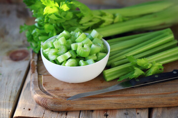 Chopped stalks of fresh celery in a bowl.