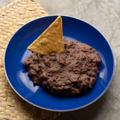 Refried beans on a gray background. Mexican food