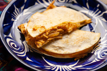 Chicken tinga quesadilla with flour tortilla. Mexican food