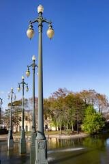 A Row of Traditional Street Lamps Rise up from the Water Fountains in the Public Louis Armstrong...