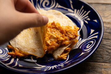 Chicken tinga quesadilla with flour tortilla. Mexican food