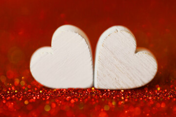 Love concept.Valentine's Day. two white hearts . Valentines day background in red tones.Love symbol. 