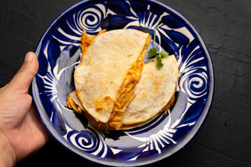 Chicken tinga quesadilla with flour tortilla. Mexican food