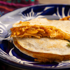 Chicken tinga quesadilla with flour tortilla. Mexican food