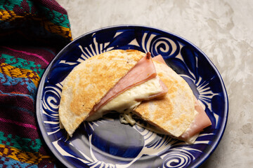 Ham and cheese quesadilla with flour tortilla. Mexican food