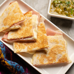 Ham and cheese quesadilla with flour tortilla. Mexican food