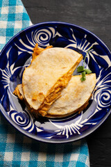 Chicken tinga quesadilla with flour tortilla. Mexican food