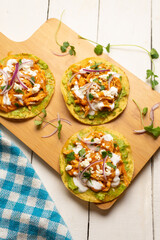 Chicken tinga tostadas with cheese and avocado. Mexican food
