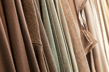 Fabric texture. clothes in a row 