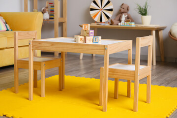 Interior of children's room with table and chairs
