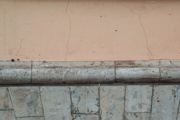 Closeup old weathered concrete wall texture with plaster. Elements of architectural decorations of buildings
