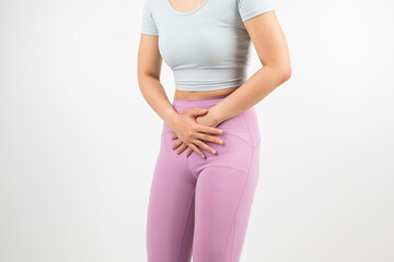 In the white background, a woman is grabbing a stomachache.