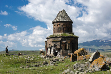 Cows graze near the ruins of the Church of St. Gregory of the Abughamir Family in the abandoned city of Ani, Eastern Anatolia, Turkey