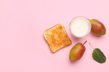 Bread with tasty pear jam and glass of milk on pink background