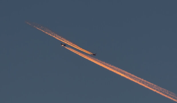 Beautiful Shot Of Two Planes With Contrails In A Blue Clear Sky