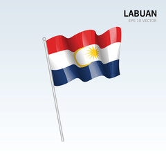 Waving flag of Labuan state and federal territory of Malaysia isolated on gray background