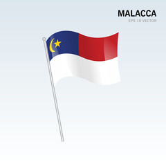 Waving flag of Malacca state and federal territory of Malaysia isolated on gray background