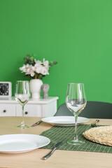 Beautiful dining table with setting in room
