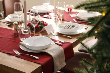 Festive table setting for Christmas celebration in dining room