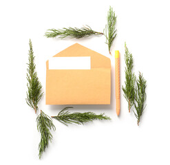 Envelope with Christmas branches on white background