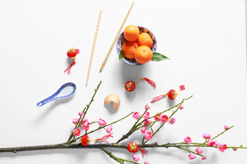 Naklejka na ściany i meble Blooming plum branches with Chinese symbols on white background